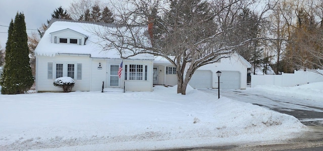 new england style home with a garage