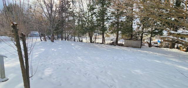 yard layered in snow with fence