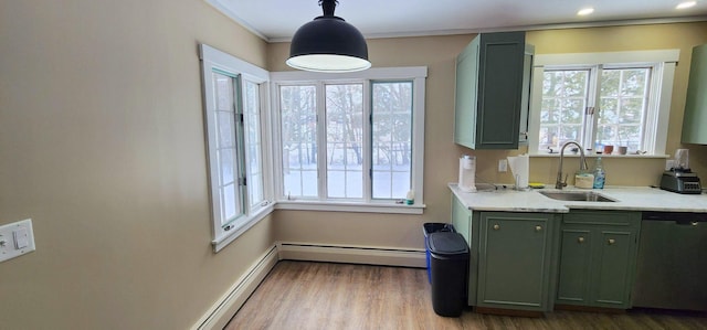 kitchen featuring a sink, baseboard heating, light countertops, green cabinets, and stainless steel dishwasher