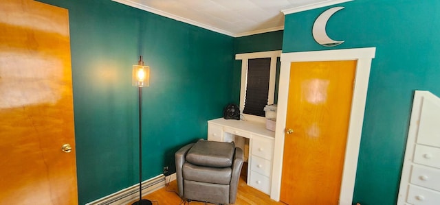 living area featuring crown molding and wood finished floors