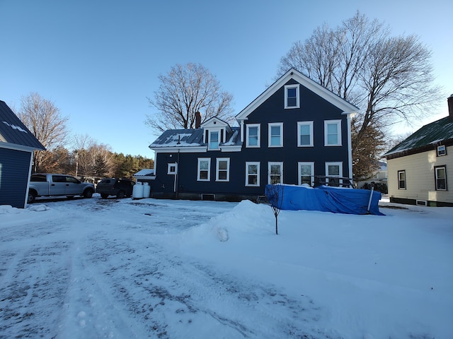 view of snow covered house