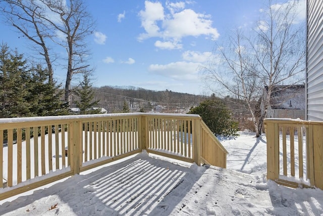 view of snow covered deck