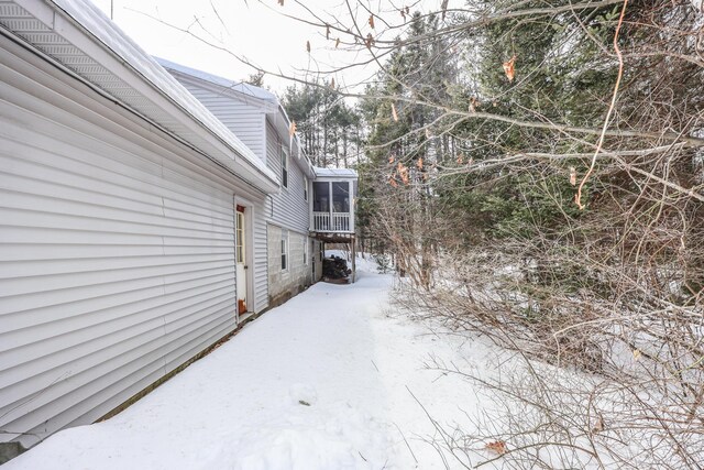 view of yard layered in snow