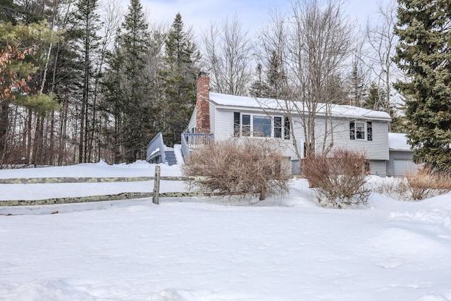 view of front of house featuring a chimney