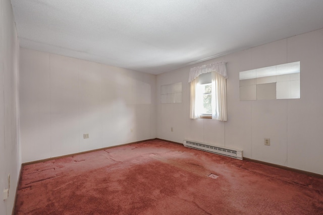 carpeted empty room featuring a baseboard radiator