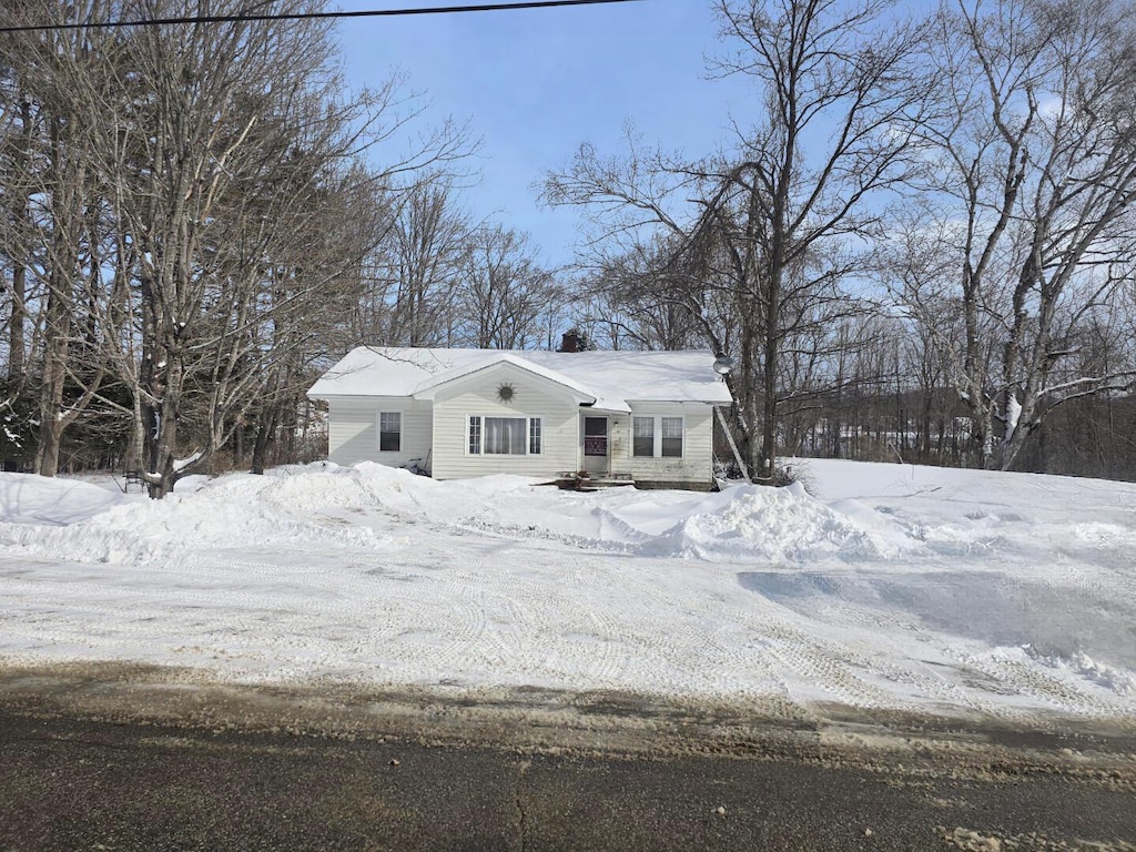 view of front of home featuring a chimney