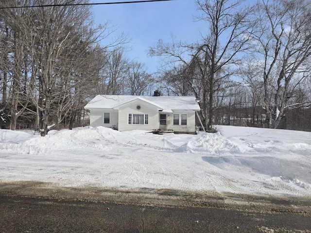 view of front of home featuring a chimney