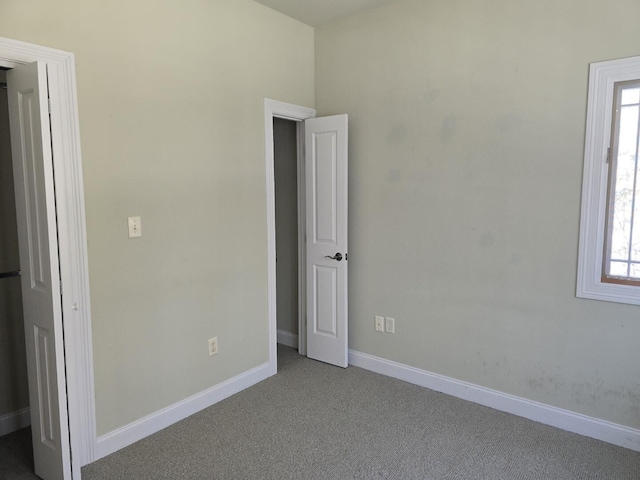 unfurnished bedroom with light carpet