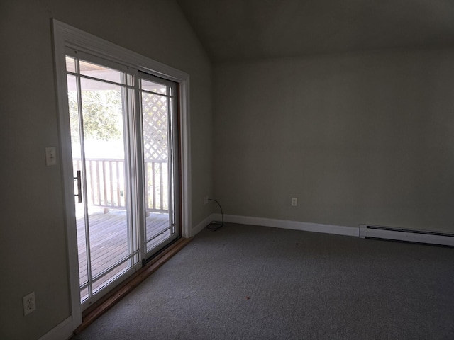 carpeted spare room featuring a baseboard radiator, a healthy amount of sunlight, and vaulted ceiling