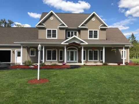 120 Bradbury Rd, Fort Kent, ME 04743 - view of front facade featuring a front yard