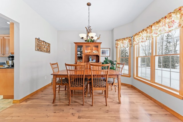 120 Bradbury Rd, Fort Kent, ME 04743 - dining space featuring a notable chandelier and light wood-type flooring