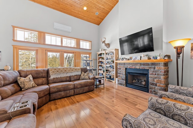 120 Bradbury Rd, Fort Kent, ME 04743 - living room featuring wood ceiling, hardwood / wood-style floors, high vaulted ceiling, a fireplace, and an AC wall unit