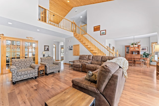 120 Bradbury Rd, Fort Kent, ME 04743 - living room with high vaulted ceiling, light wood-type flooring, and french doors