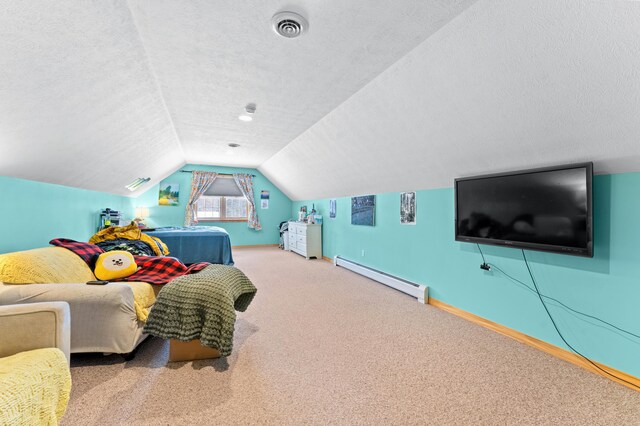 120 Bradbury Rd, Fort Kent, ME 04743 - bedroom featuring a baseboard radiator, vaulted ceiling, a textured ceiling, and carpet