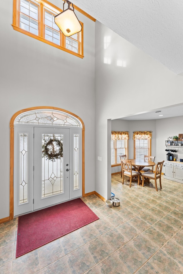 120 Bradbury Rd, Fort Kent, ME 04743 - foyer featuring a towering ceiling and a textured ceiling