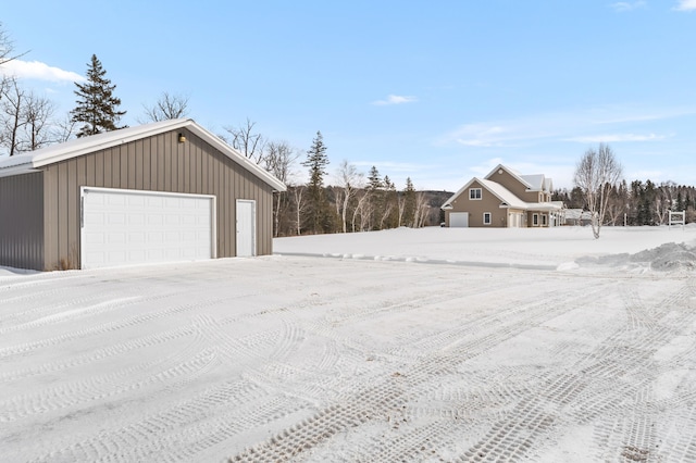 120 Bradbury Rd, Fort Kent, ME 04743 - snowy yard featuring a garage and an outdoor structure