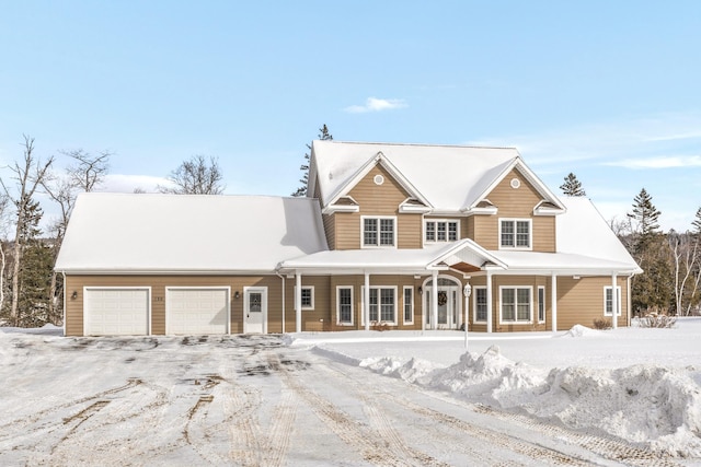 view of front of house with a garage and covered porch