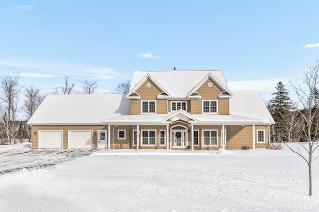 view of front of house with a porch and a garage