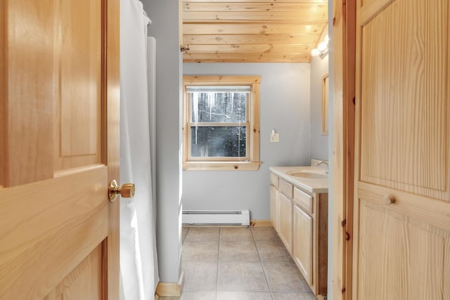 bathroom with vanity, a baseboard heating unit, tile patterned floors, and wood ceiling