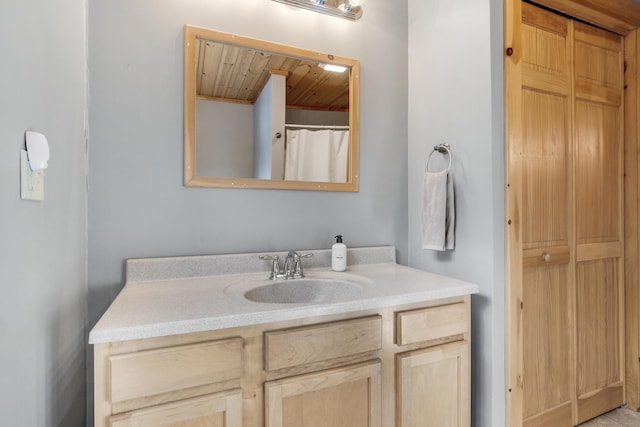 bathroom featuring vanity and wood ceiling