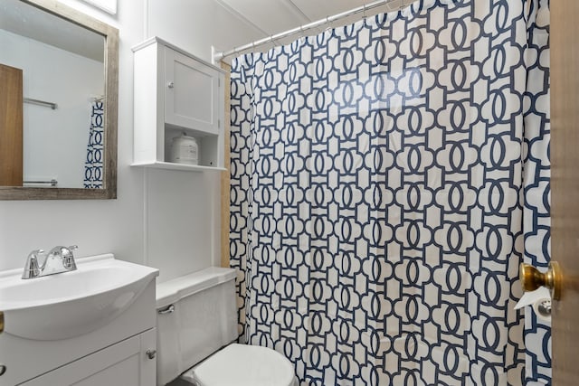 bathroom with vanity, a shower with curtain, and toilet