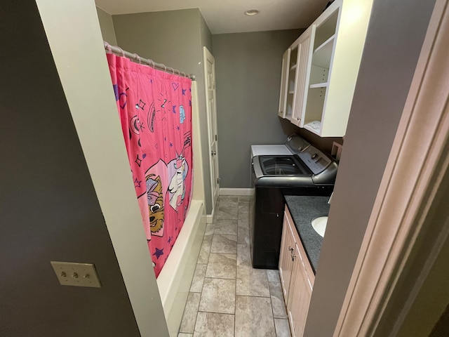 clothes washing area with washer and dryer