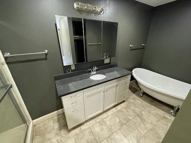 bathroom featuring vanity and a tub to relax in