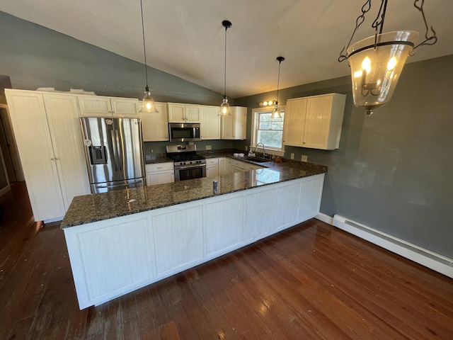 kitchen featuring sink, baseboard heating, appliances with stainless steel finishes, dark hardwood / wood-style floors, and decorative light fixtures