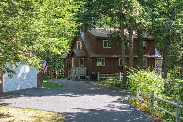 417 Middle Rd, Falmouth, ME 04105 - view of front of home featuring an outbuilding, aphalt driveway, a garage, and fence