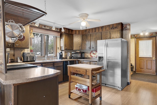 417 Middle Rd, Falmouth, ME 04105 - kitchen featuring dark brown cabinets, tasteful backsplash, a ceiling fan, and black appliances