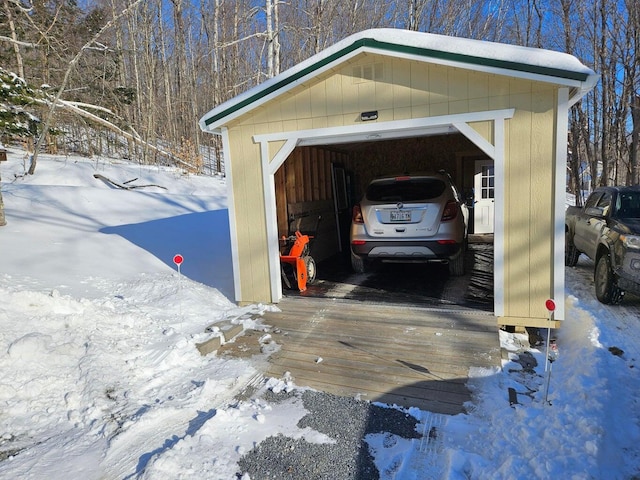 view of snow covered garage