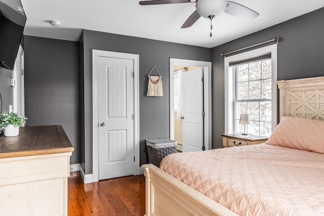 bedroom featuring dark wood-type flooring and ceiling fan