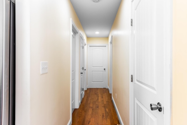 corridor with dark wood-type flooring