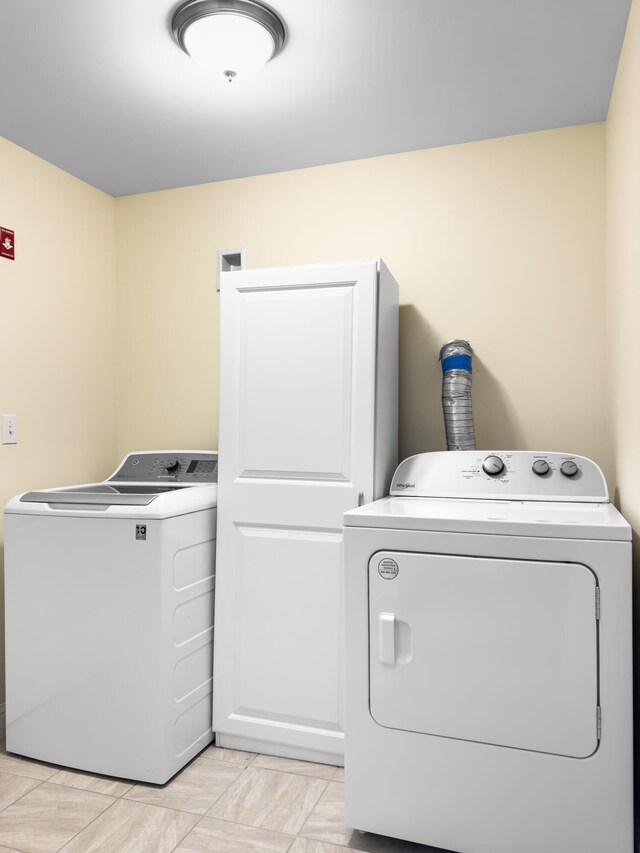 washroom with independent washer and dryer