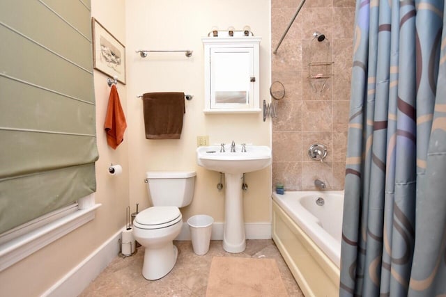 bathroom with tile patterned floors, toilet, and shower / tub combo