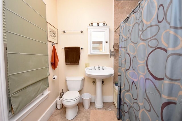 full bathroom featuring sink, tile patterned floors, toilet, and shower / tub combo