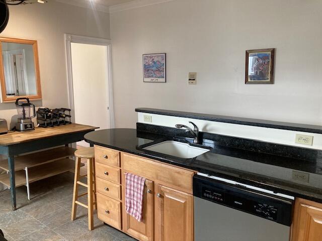 kitchen with dishwasher, sink, and ornamental molding