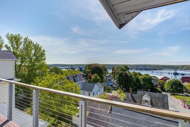 balcony featuring a water view