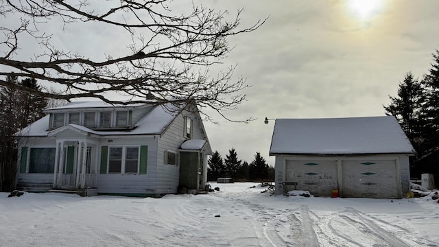 view of snow covered exterior featuring a garage