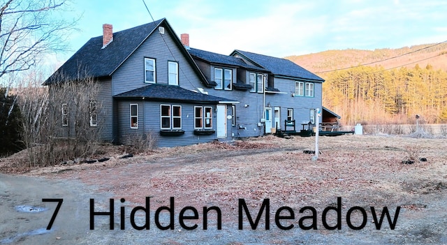 7 Hidden Meadow Ln, Dixfield, ME 04224 - exterior space with a mountain view and a chimney