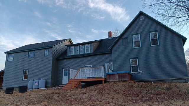 7 Hidden Meadow Ln, Dixfield, ME 04224 - rear view of house with a wooden deck and a chimney