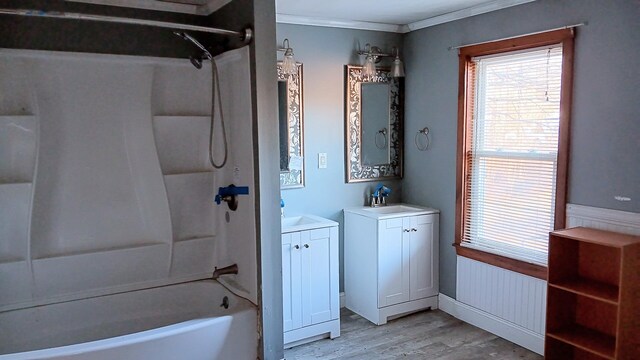 7 Hidden Meadow Ln, Dixfield, ME 04224 - full bathroom featuring two vanities, ornamental molding, shower / washtub combination, a sink, and wood finished floors