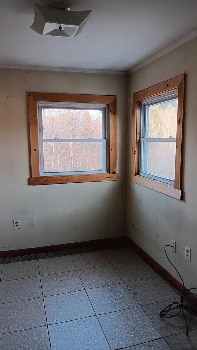 7 Hidden Meadow Ln, Dixfield, ME 04224 - tiled empty room with baseboards and ornamental molding