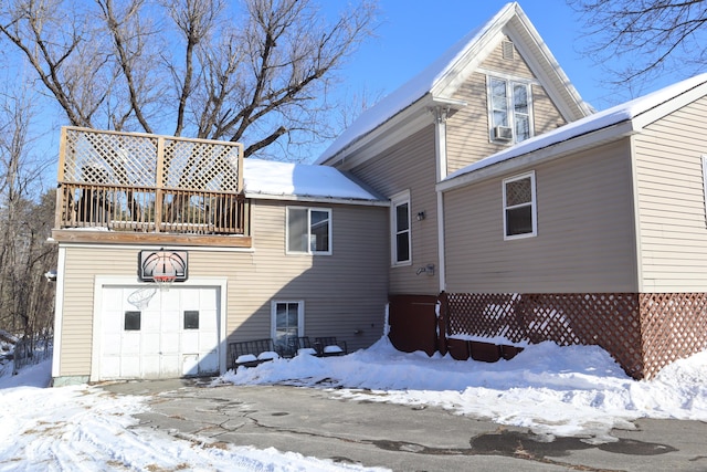 exterior space with a balcony and a garage