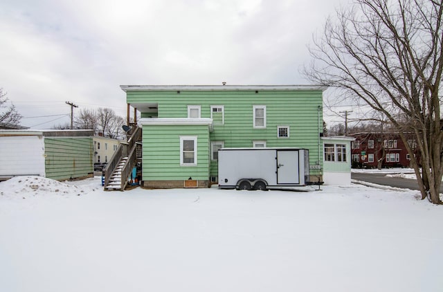 view of snow covered house