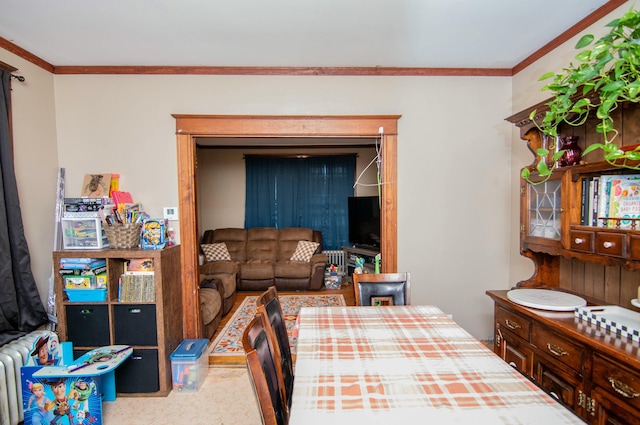 carpeted dining room featuring crown molding