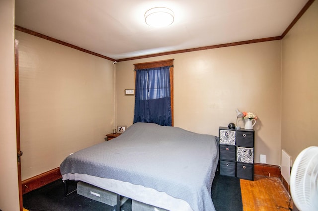 bedroom with crown molding