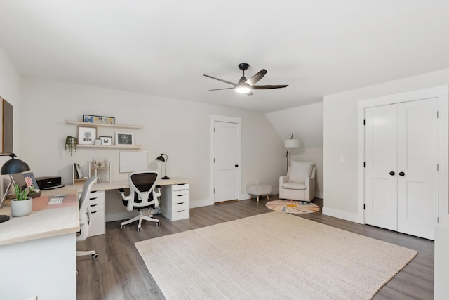 office area with ceiling fan, dark hardwood / wood-style floors, and vaulted ceiling