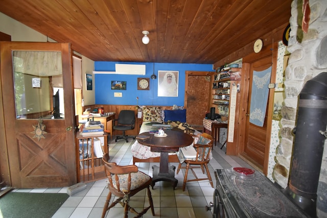 tiled dining area featuring wood ceiling