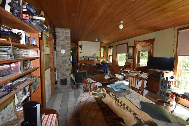 dining room with wood ceiling and light tile patterned floors